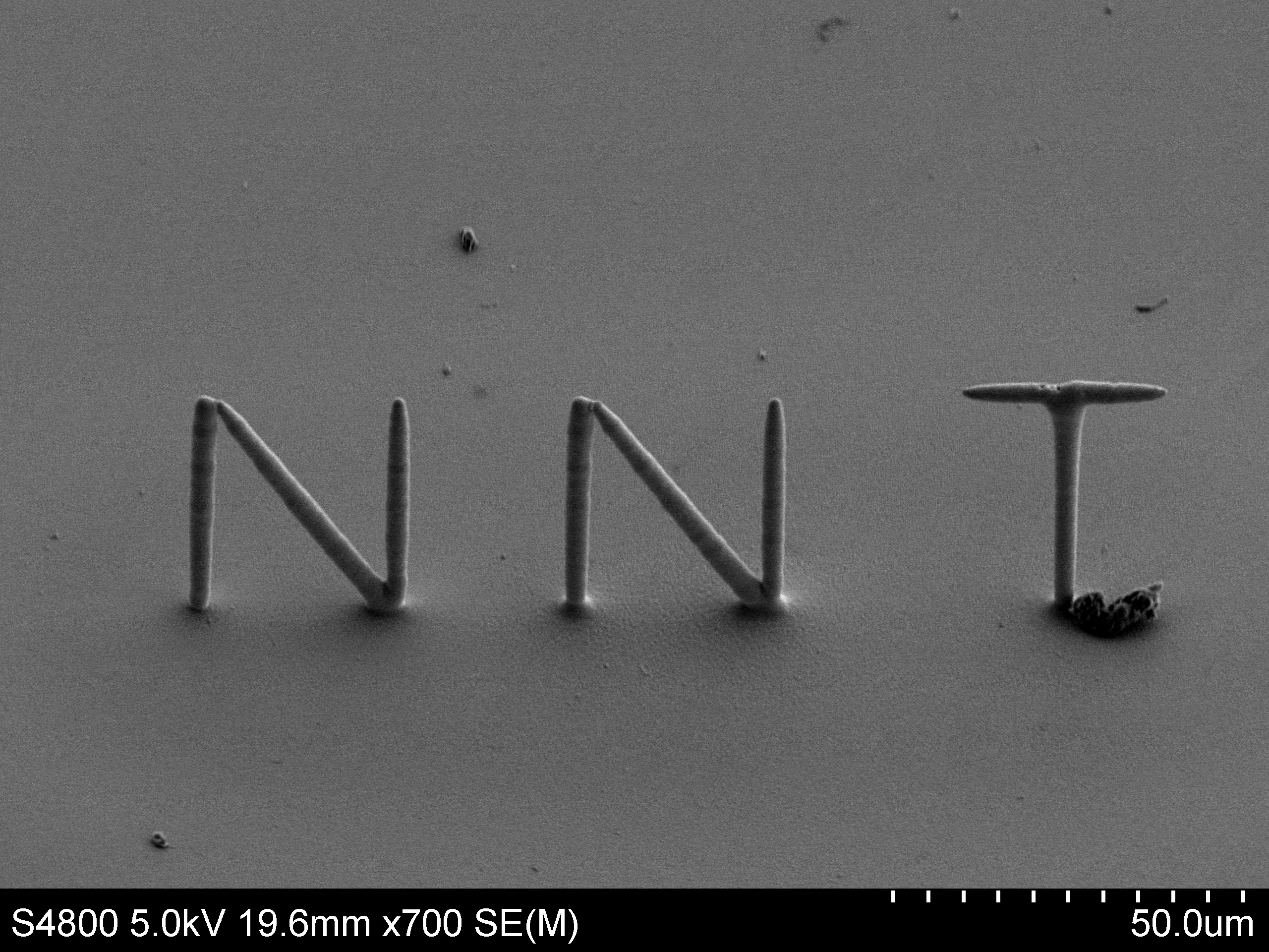Microscale 3D printed Jayant lab initials - Nano NeuroTech Lab